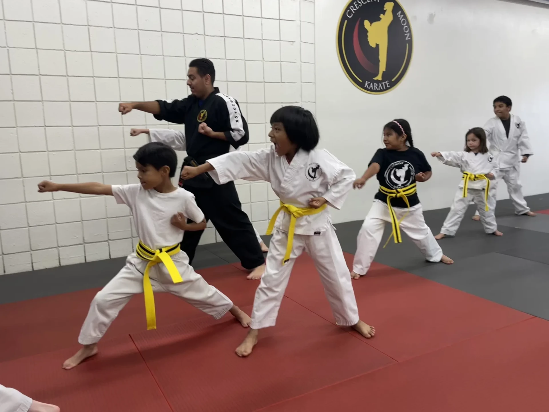 Kids practicing punches in class